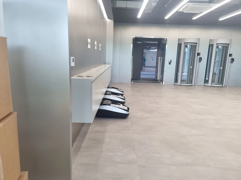QUEN shoe cover machines at a data center entrance